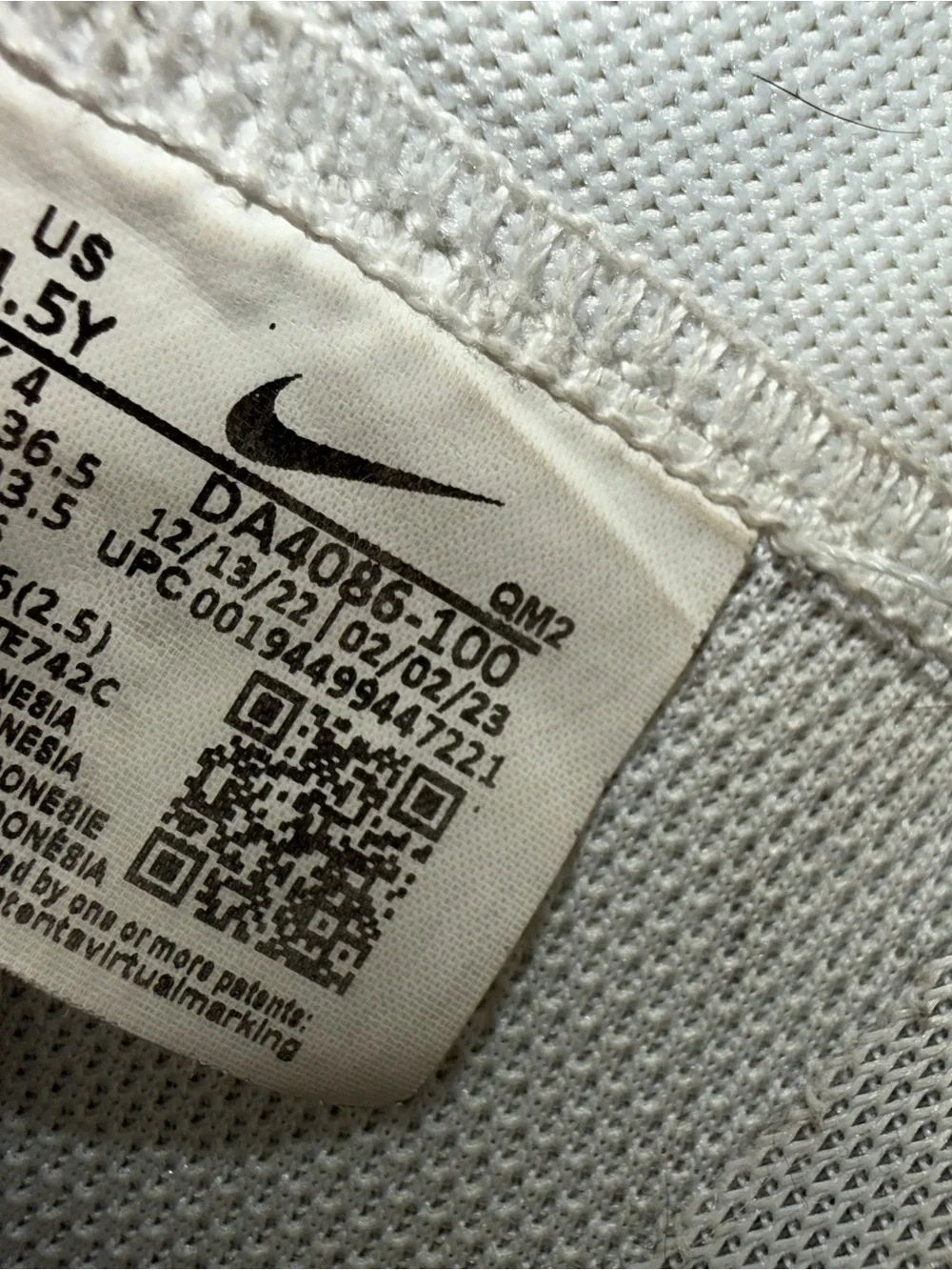 Nike Kids White High-Top Sneakers with Black Swoosh
